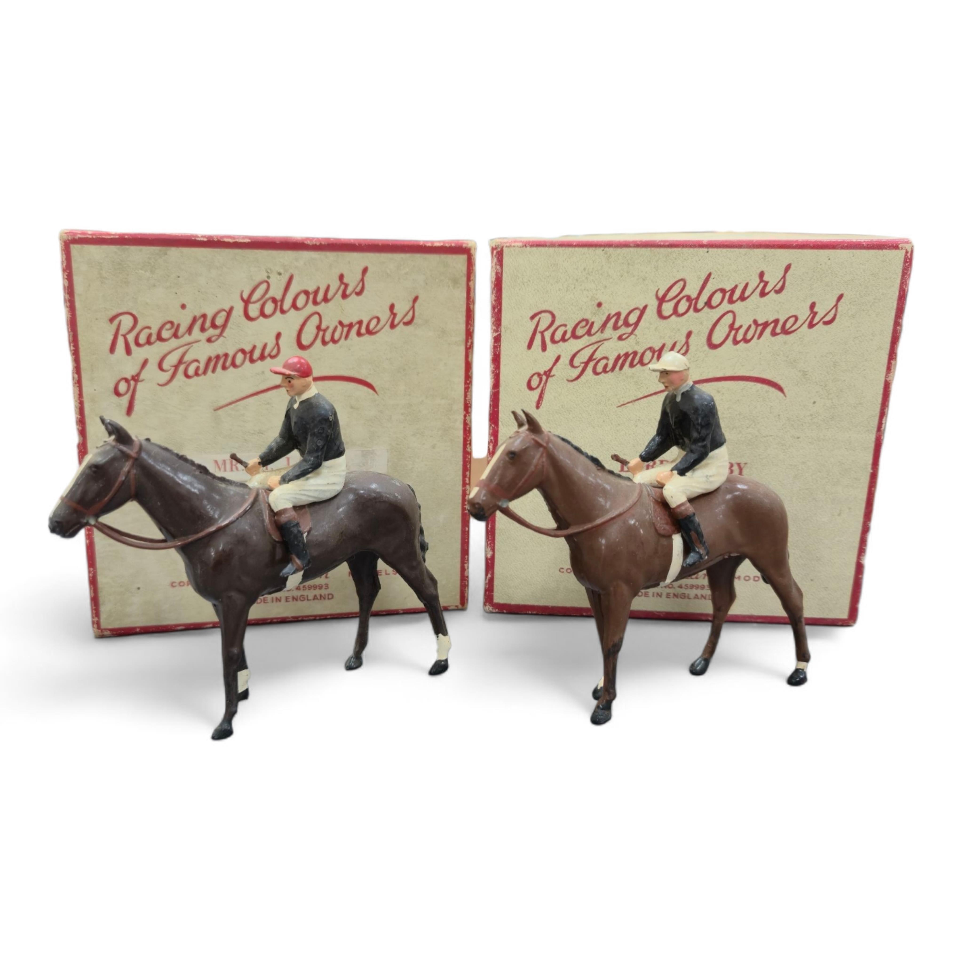 Two boxed Britains Racing Colours of Famous Owners series lead mounted figures; Lord Derby - rider in black jersey with a white cap on a brown horse, and Mr. H. J. Joel - rider in black jersey with red cap on a dark brow